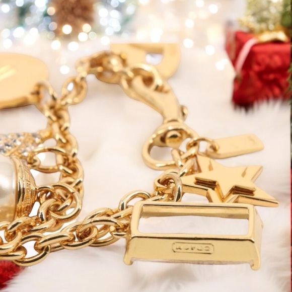 Coach Gold Tone Multi Charm Bracelet. Includes locket Heart, Bird, Star and more - Picture 4 of 17